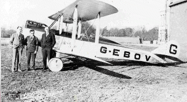 Roy Chadwick, Bert Hinkler, and R.J. Parrott standing beside an Avro Avian