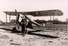 Roy Chadwick standing beside the Avro Baby light aeroplane